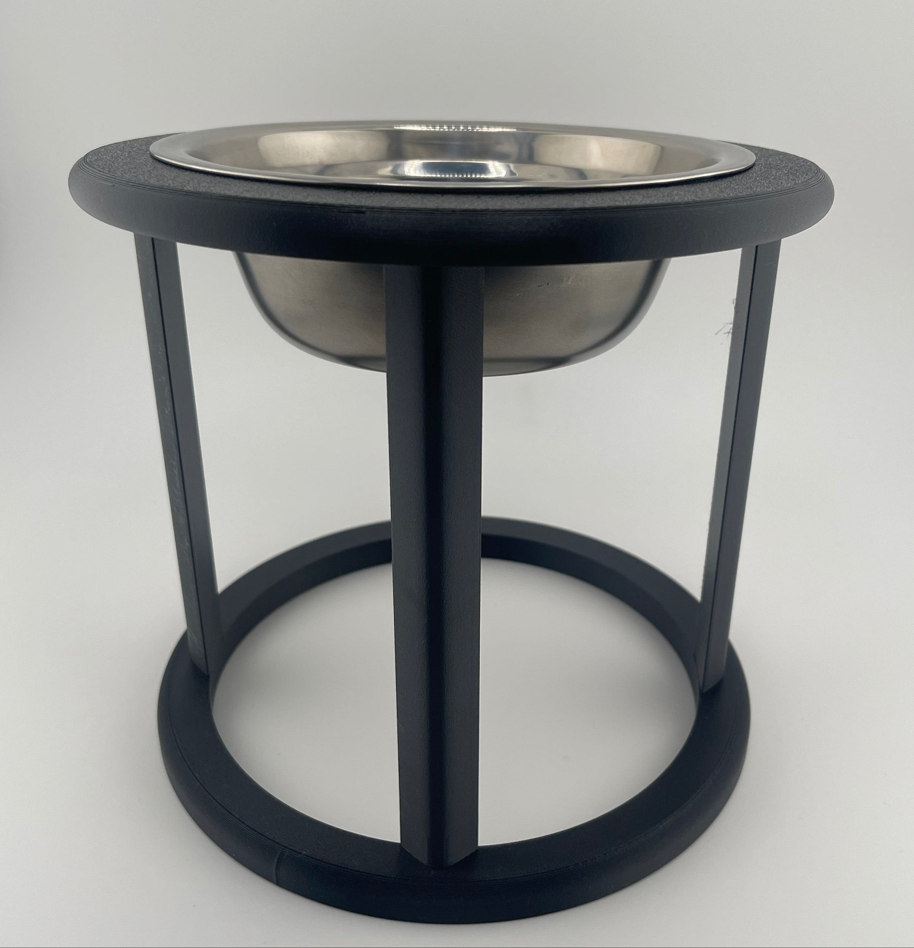 Black elevated cat bowl on white background, minimalist raised feeder for cats UK